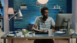 © DC Studio - Businessman working from home with computer in workspace. Corporate worker doing online remote networking on modern device. Entrepreneur typing on keyboard for professional work