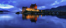 Panoramic View Of Eileen Donan Castle At Dusk On The Shores Of Loch Duich, West Highlands, Scotland, UK.