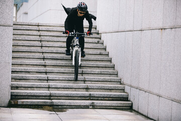 Wall Mural - Woman freerider riding down city stairs