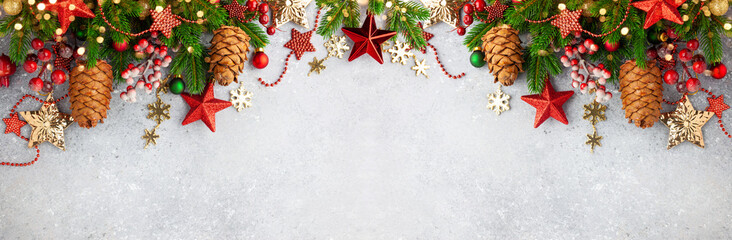 Wall Mural - christmas or new year banner with green fir branches, red berries, christmas ornaments and cones. wi