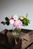 Fototapeta  - Bouquet of summer flowers on a wooden table