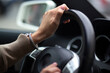 © ViRusian - woman's hands on the steering wheel in the car
