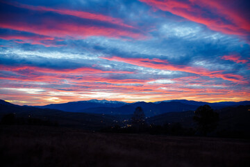 Wall Mural - gorgeous sunset with cloudy sky in the mountains.