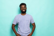 © F8  \ Suport Ukraine - African american man laughing against turquoise background