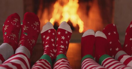 Wall Mural - Family in Christmas socks near fireplace