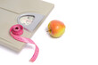 © freeman83 - Scales with measuring tape and apple, symbol and concept weight loss, sports and fitness.