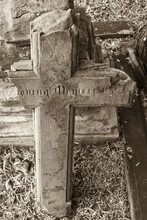 Vertical Shot Of A Weathered Gravestone