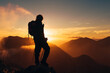 © Alberto - backlit silhouette of hiker with backpack and poles on top of a mountain watching the sunset. sport and healthy life concept.