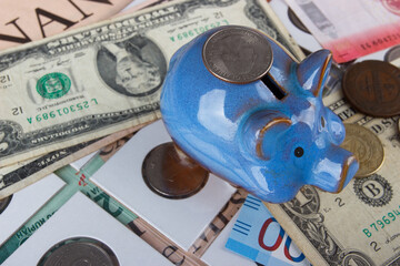 Background from different collector coins and banknotes with a magnifying glass