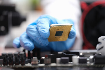 Sticker - Repairman installing computer processor into motherboard closeup