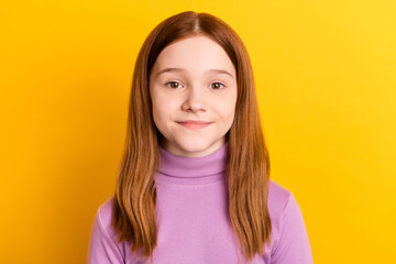 Poster - Close-up portrait of nice attractive red-haired girl schoolchild wearing lilac jumper isolated over bright yellow color background