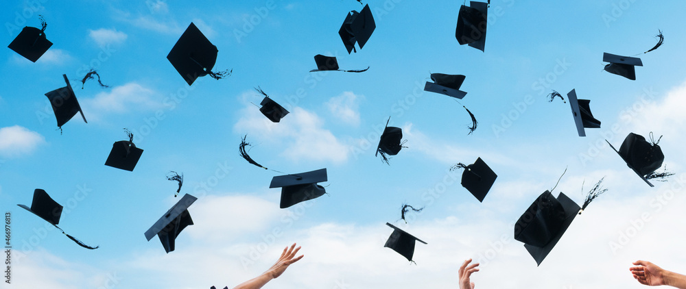 Graduating students hands throwing graduation caps in the air Stock ...