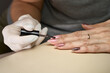 © Aleksandrs - Woman doing manicure for herself. High quality photo