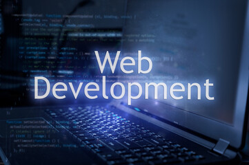 Wall Mural - web development inscription against laptop and code background. learn web development programming la