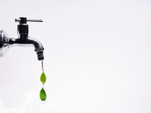 Conceptual Water Droplets Dripping From A Tap