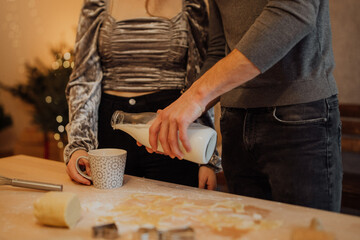 Wall Mural - Couple preparing delicious holiday cookies