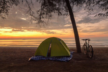 Bicycle Parked By A Tree And A Tent On An Empty Beach, Wannakorn Beach, Petburi Province, Thailand