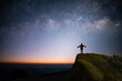 © Tarokmew - Silhouette of young traveler and backpacker watched the star, milky way and beautiful view night sky alone on top of the mountain. He enjoyed traveling and was successful when he reached the summit.
