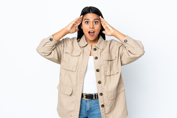 Wall Mural - Young latin woman woman isolated on white background with surprise expression