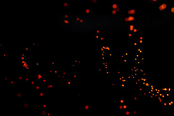 Wall Mural - macro shot of orange particles on black background