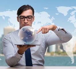 Wall Mural - Businessman holding globe in global business concept