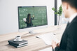 © Who is Danny - European businessman at office desk looking at computer screen with online education chalkboard and formulas pattern. Digital knowledge and webinar concept.