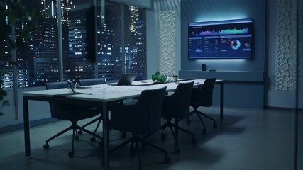 Aufkleber - Modern Empty Meeting Room with Big Conference Table with Various Documents and Laptop on it. Wall TV Showing Company's Growth, Statistics, Graphs and Pie Charts. Late Evening or Night City Outside.