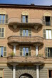 Eclectic facade. Eclectic facade of a residential building.Brick brick building with curvilinear terraces and decorations.  Asti, Piedmont, Italy.