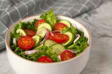 Vegetable Salad With Cucumber, Tomato, Onion And Green Salad. Close Up Photo Of Healthy Food