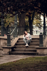 Canvas Print - Shallow focus of a caucasian female with an autumn outfit posing on a blurred background