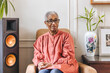© Lisa Weatherbee - Portrait of an elderly black woman sitting in a chair in her living room