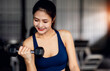 © David - Asian Young Sportswoman in gym exercise muscles