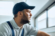 © Drazen - Young pensive mechanic works at auto repair shop.