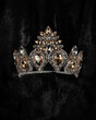 beautiful silver crown with a yellow stone for a beauty pageant on a black background, accessory headdress, close-up