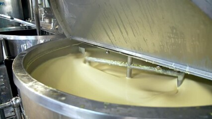 Wall Mural - Butter production line at dairy industry. Close up view of butter production at dairy plant