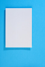 Blank Paper On Blue Background