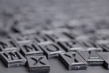 Wall Mural - letterpress alphabet on black background