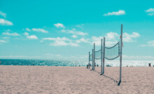 Side View Of Volleyball Nets On Seashore