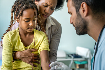 Wall Mural - Pediatrician takes blood from a child patient. Healthcare antibody test coronavirus concept