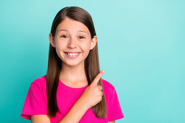 Sticker - Photo of cheerful happy positive little girl point finger empty space enjoy sale season isolated on teal color background