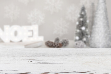 Christmas styled scene behind a wooden table. Background with an empty table for digital product mockups.