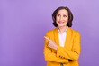 Photo of nice brunette old lady indicate look empty space wear yellow jacket isolated on violet color background
