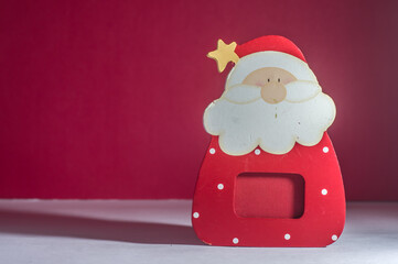 Wall Mural - Christmas ornament, Santa Claus with red and white background, selective focus