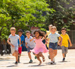 © JackF - Cheerful active children are racing along the city street