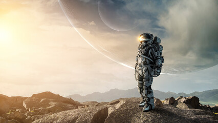 Wall Mural - Astronaut walking on an unexplored planet . Mixed media