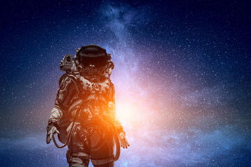 Wall Mural - astronaut walking on an unexplored planet