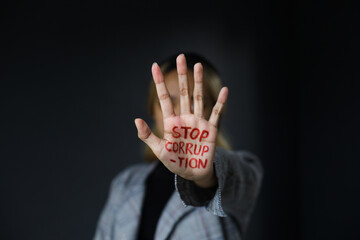 Woman shows hand sign of 