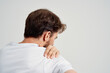 © SHOTPRIME STUDIO - man holding neck arthritis health problems isolated background