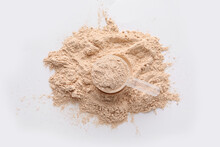 Measuring Scoop With Protein Powder On White Background