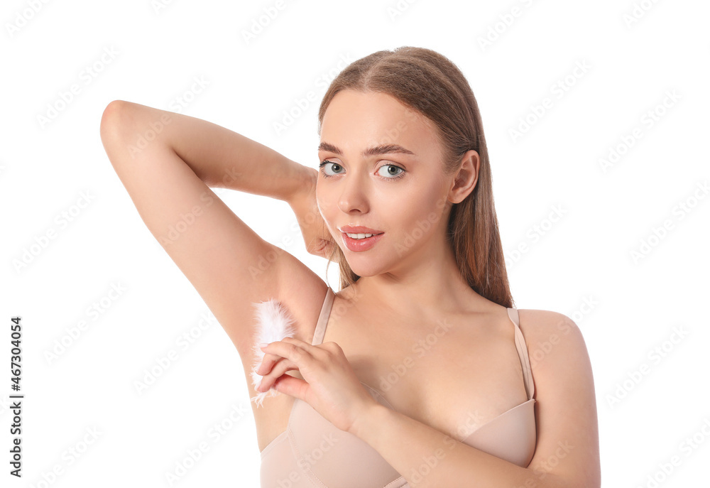 Beautiful young woman with soft feather on white background. Epilation concept